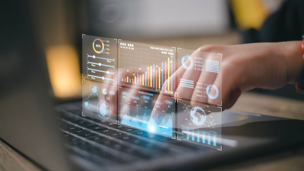 user analyzing data on laptop
